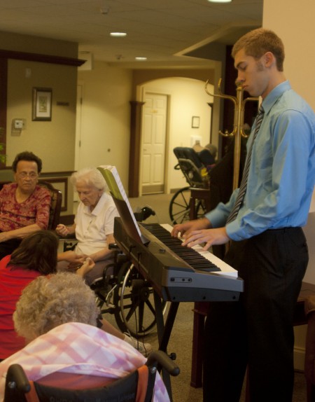 Music to Elderly Ears: Ferris State student Jordan Scott has been playing piano for elderly Big Rapids citizens. Jordan performs a large range of music selections at several assisted living facilities. Photo By: Kate Dupon | Photo Editor Music to Elderly Ears: Ferris State student Jordan Scott has been playing piano for elderly Big Rapids citizens. Jordan performs a large range of music selections at several assisted living facilities. Photo By: Kate Dupon | Photo Editor