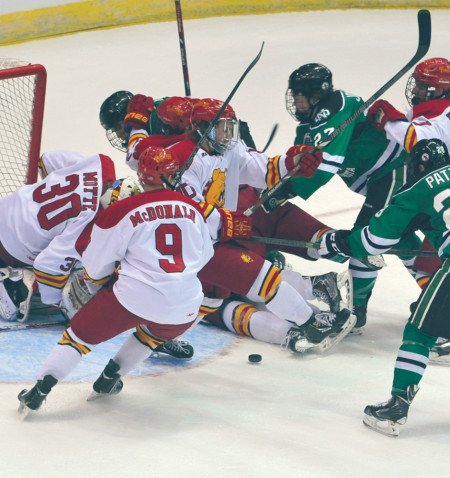 Ferris junior goaltender and top-ten Hobey Baker finalist CJ Motte, who allowed just two goals in the NCAA tournament, is faced with a scrum during the game against North Dakota. Courtesy Photo By: Bill Bitzinger | FSU Photo Services